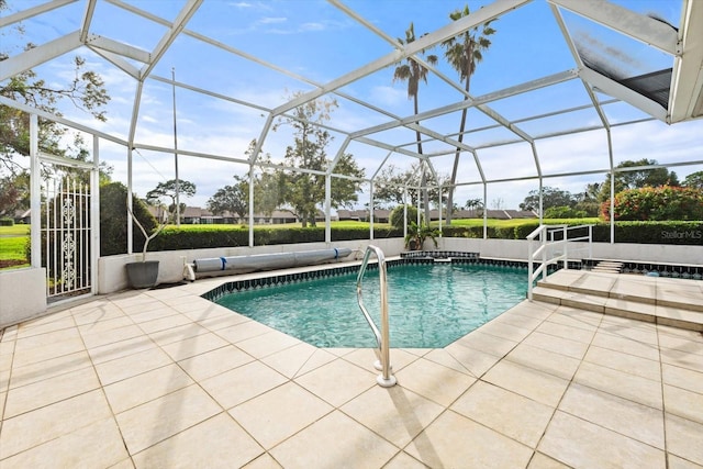 view of swimming pool featuring glass enclosure and a patio area