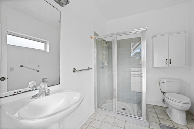 bathroom featuring toilet, tile patterned flooring, an enclosed shower, and sink