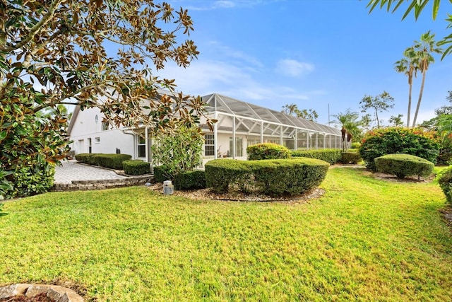 view of yard with a lanai