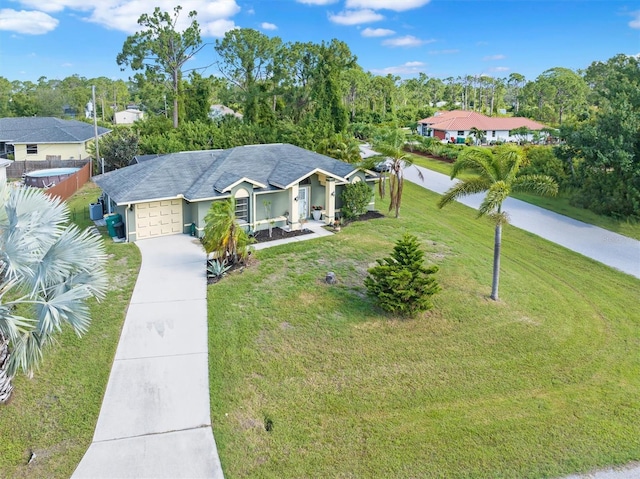 ranch-style home featuring a front lawn and a garage