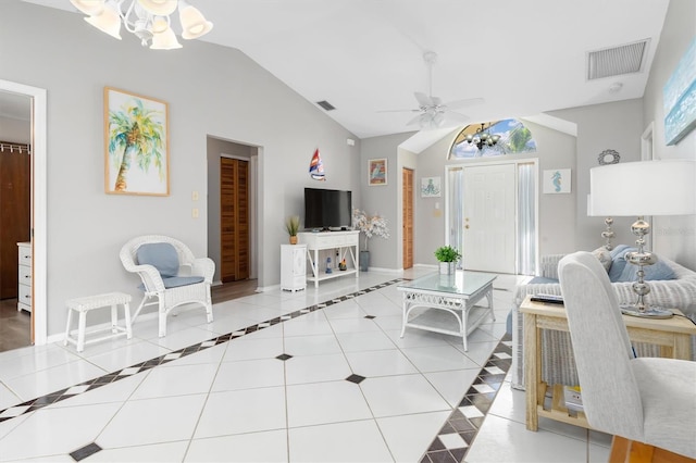 tiled living room with ceiling fan and lofted ceiling