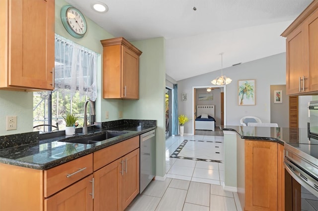 kitchen featuring dark stone counters, sink, vaulted ceiling, stainless steel dishwasher, and light tile patterned floors