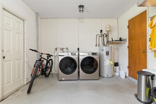 laundry area featuring washing machine and clothes dryer and water heater