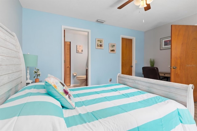 bedroom with ceiling fan and ensuite bath