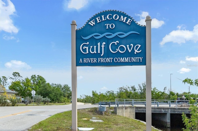 community sign with a water view