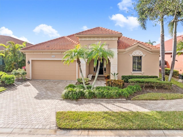 mediterranean / spanish-style house featuring a garage