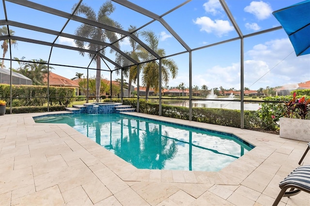 view of swimming pool with a lanai, a patio area, and a water view