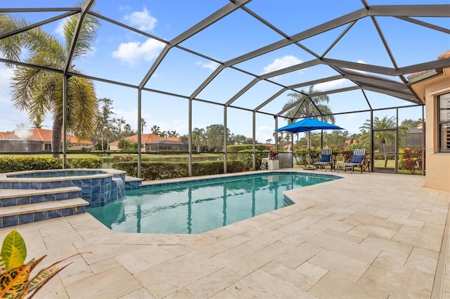 view of swimming pool featuring a lanai, a patio area, and an in ground hot tub