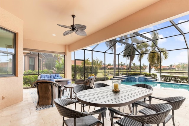 view of patio featuring ceiling fan, a lanai, an outdoor living space, a swimming pool with hot tub, and a water view