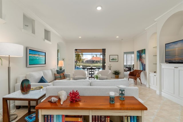 living room with built in shelves, crown molding, and light tile patterned flooring