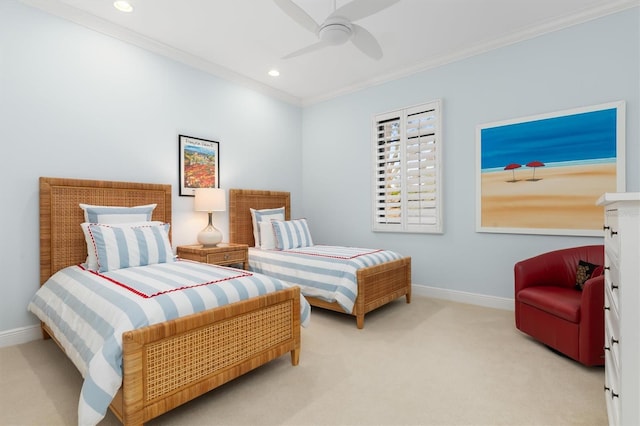 carpeted bedroom with ceiling fan and crown molding