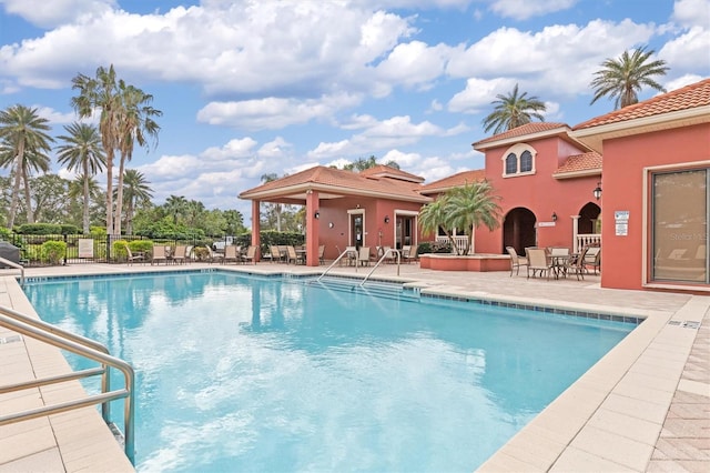 view of swimming pool with a patio area