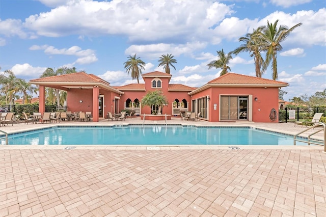 view of swimming pool featuring a patio area