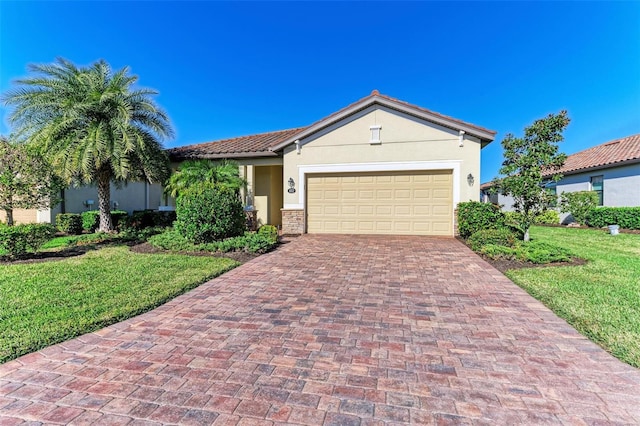 view of front of property featuring a garage and a front lawn