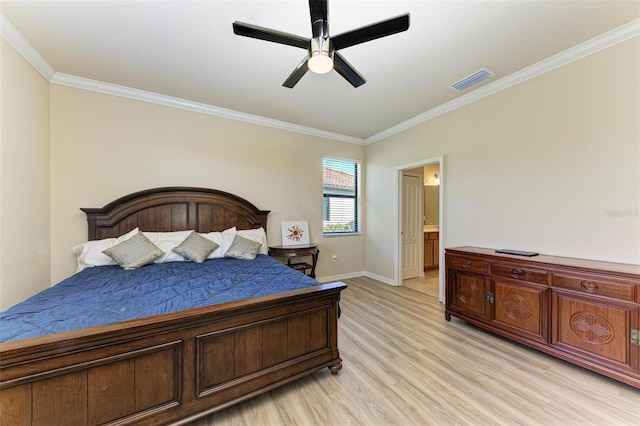 bedroom featuring ceiling fan, ornamental molding, light hardwood / wood-style flooring, and ensuite bath