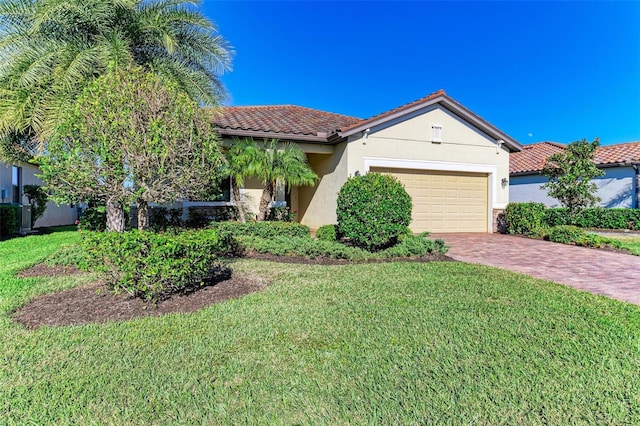 view of front of house with a front yard and a garage