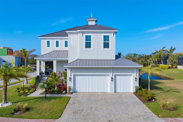 view of front facade featuring a garage and a front lawn