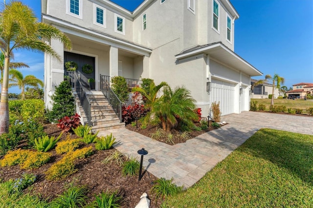 view of front of house featuring covered porch and a garage