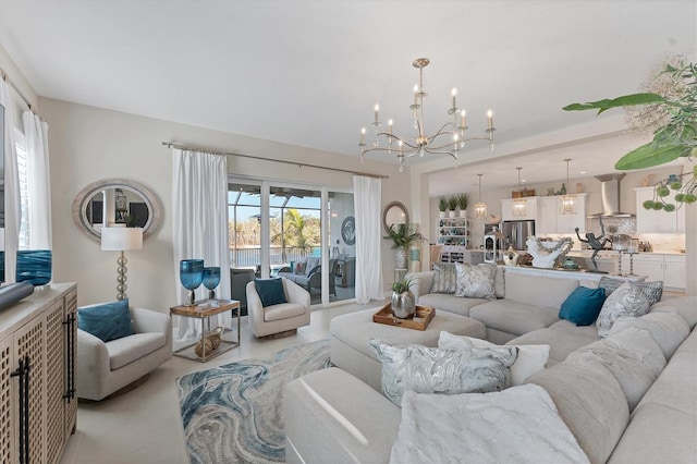 tiled living room featuring a wealth of natural light and a notable chandelier