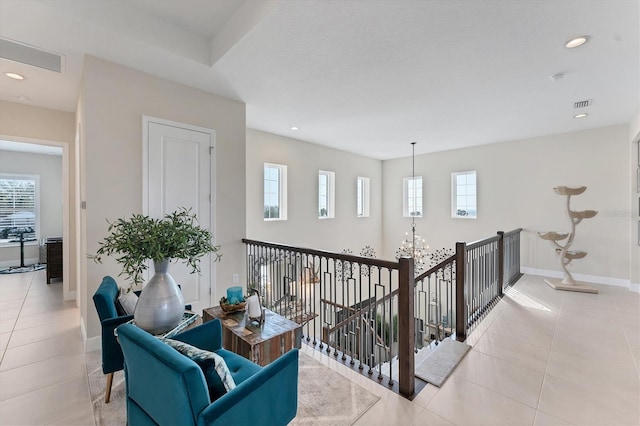 hallway with light tile patterned floors