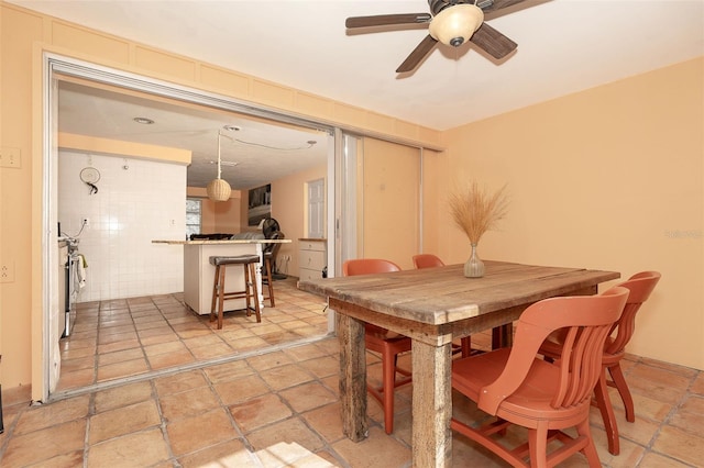 dining room featuring ceiling fan