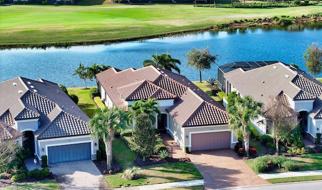 birds eye view of property with a water view