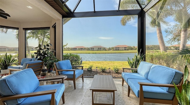 sunroom / solarium with a water view