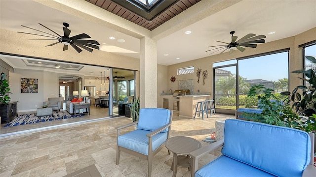 view of patio featuring exterior bar, an outdoor hangout area, and exterior kitchen