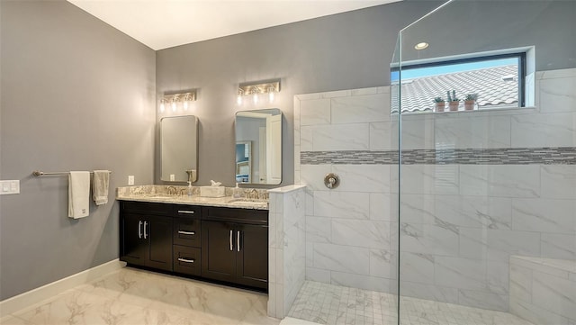 bathroom featuring vanity and tiled shower