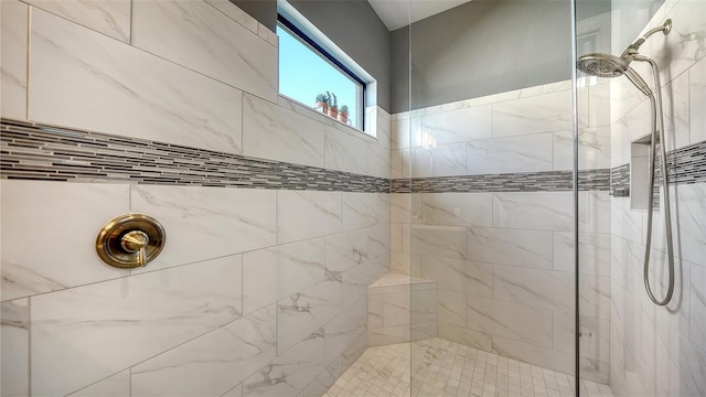 bathroom with tiled shower