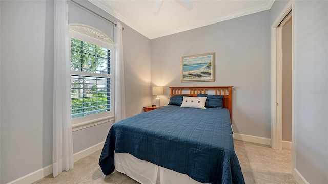 bedroom featuring ceiling fan, a closet, and ornamental molding