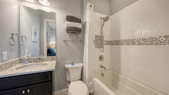 full bathroom featuring shower / bath combination with curtain, vanity, and toilet