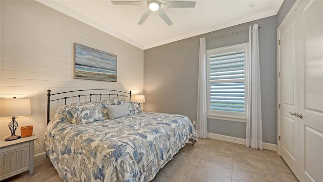 bedroom featuring ceiling fan, ornamental molding, and wooden walls