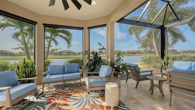 sunroom / solarium featuring a water view