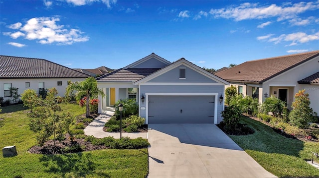 view of front of property featuring a garage and a front lawn