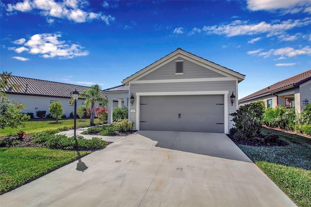 view of front of house with a front lawn and a garage