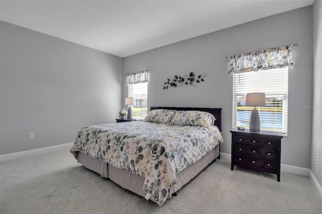 bedroom featuring light carpet