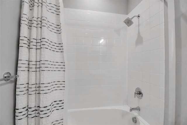 bathroom featuring shower / bath combination with curtain