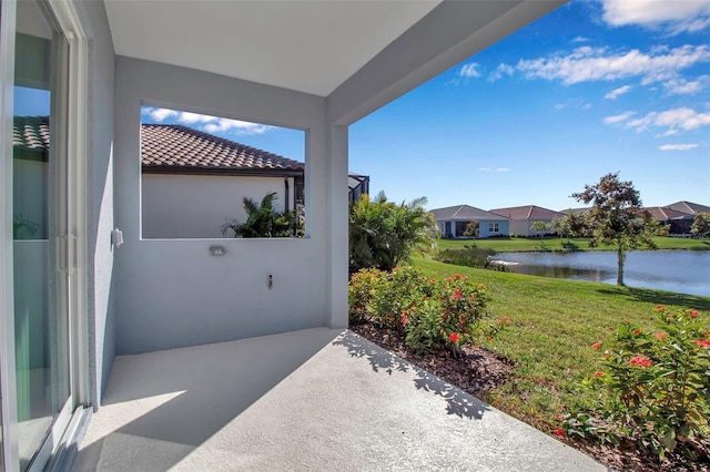 view of patio / terrace featuring a water view