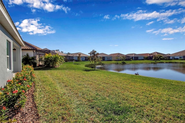 view of yard with a water view