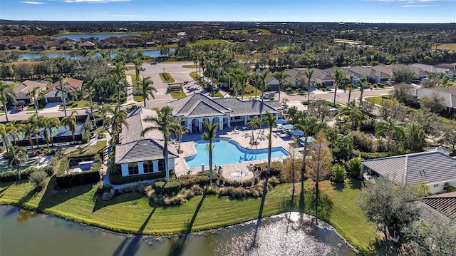 birds eye view of property with a water view