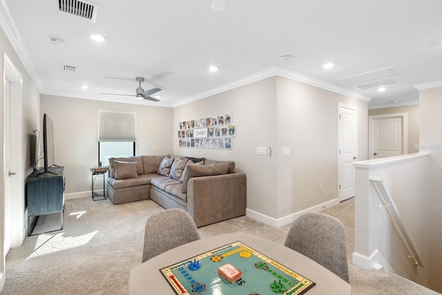 living room featuring ceiling fan, light colored carpet, and crown molding