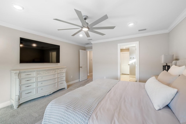 carpeted bedroom with ensuite bathroom, ceiling fan, and ornamental molding