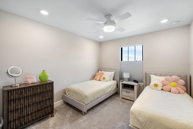 bedroom with ceiling fan and carpet