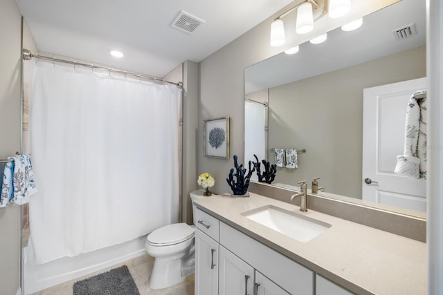 full bathroom with toilet, vanity, tile patterned flooring, and shower / bath combo