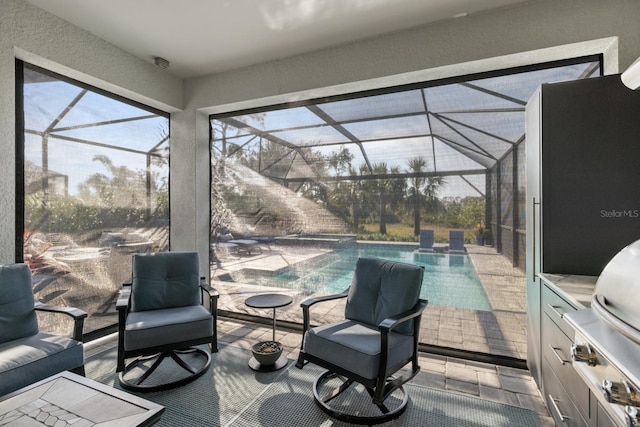 view of patio with a lanai and area for grilling