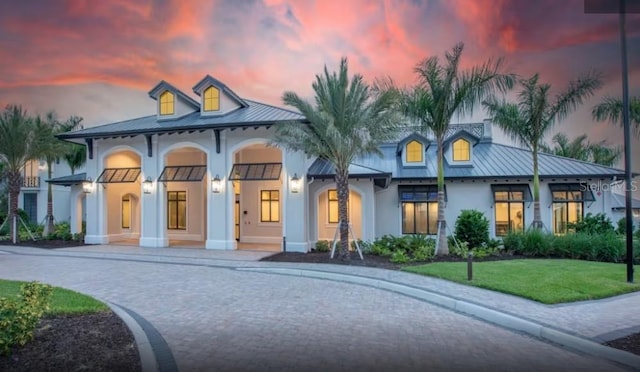 view of front of home with a lawn