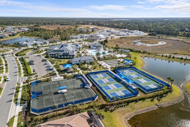 birds eye view of property with a water view