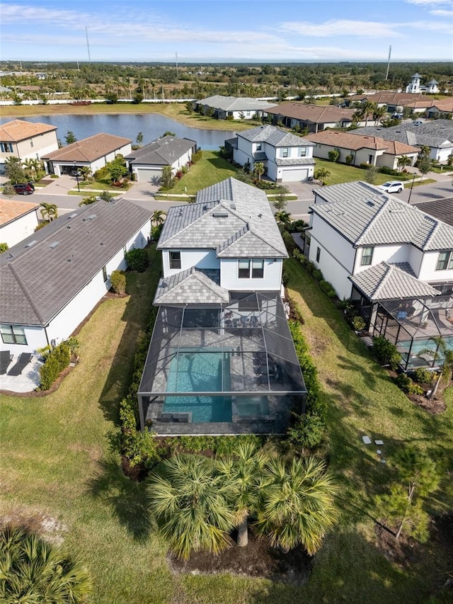 bird's eye view with a water view