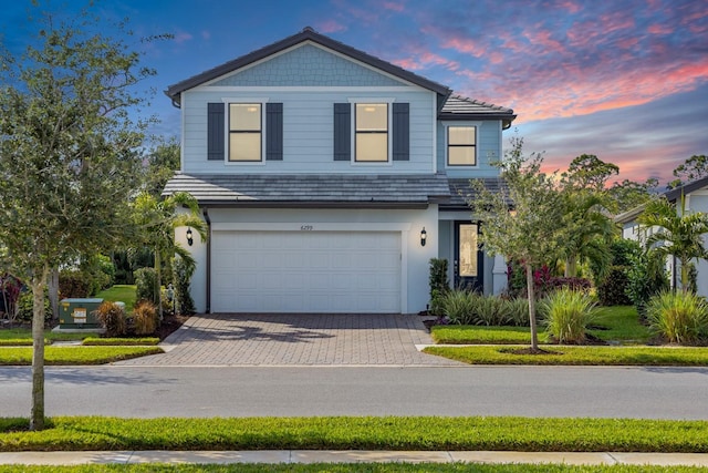 front of property with a garage